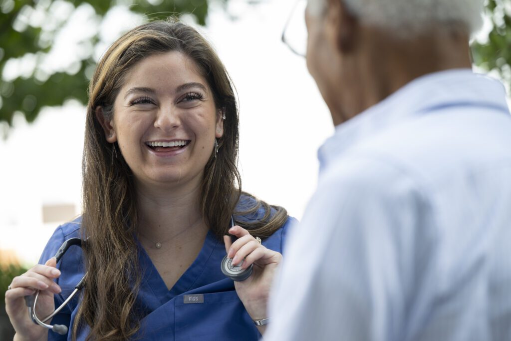 Nurse Care Manager Laughing with Senior Client